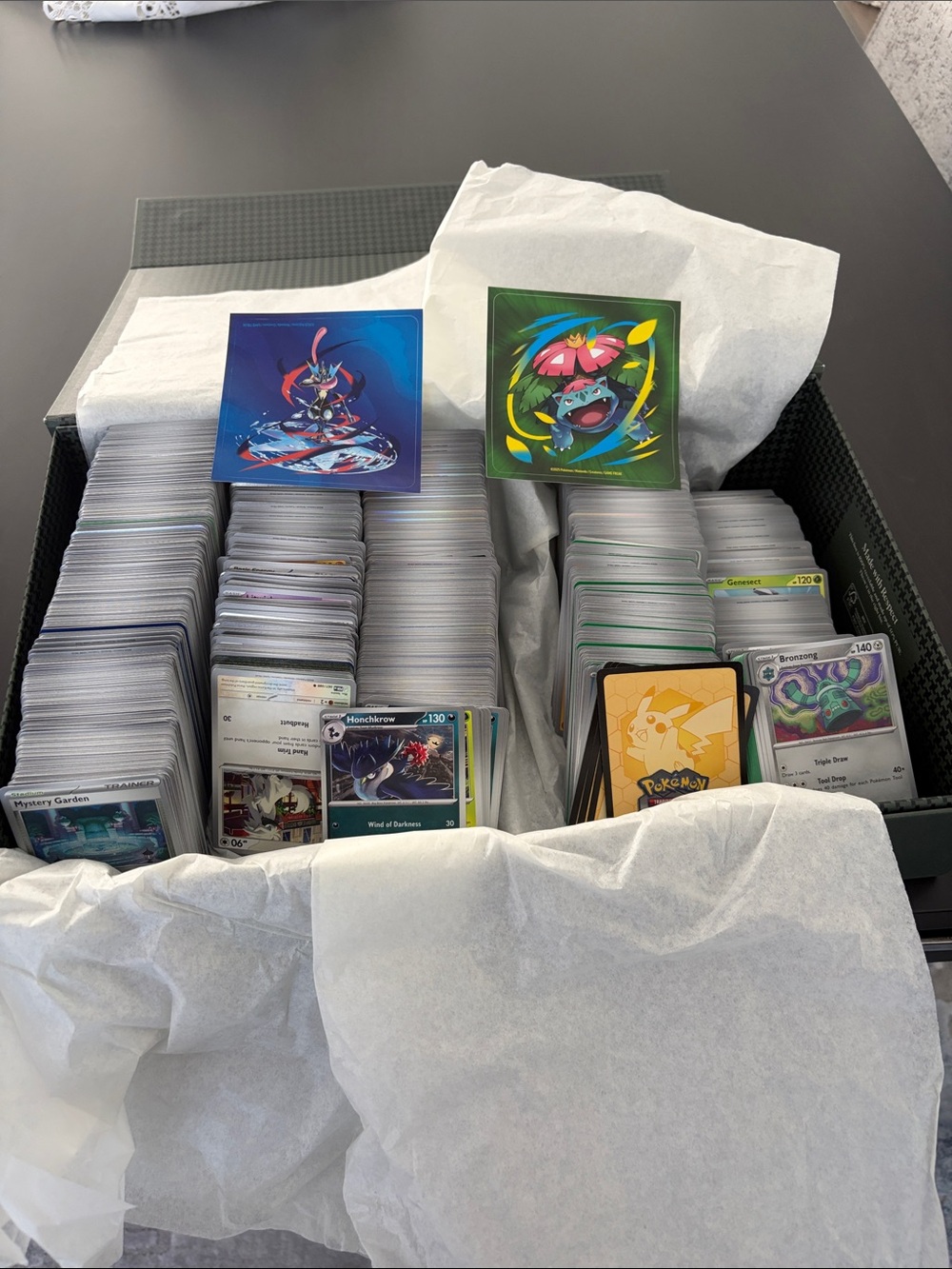 Pokemon Card Collection with Green and Blue Sleeves